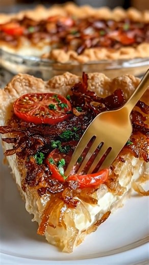 Bacon Onion Tomato Pie *Some recipes feel like they’ve been passed down through generations—simple, savory, and wonderfully comforting. This cozy Bacon Onion Tomato Pie captures that charm with smoky bacon, sweet onions, juicy tomatoes, and a golden, creamy topping.* What You'll Need (1) pre-baked deep 9-inch pie shell (6–8 slices) bacon or turkey bacon, fried crisp and chopped (2) tomatoes, thinly sliced (1 large) yellow onion, very thinly sliced (1 1/2 cups) shredded mozzarella (1/2 cup) mayon