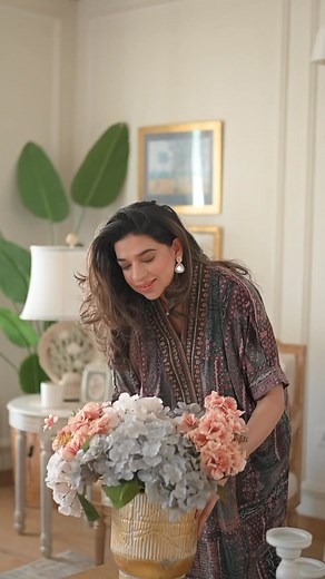 Be the heart of every mehfil in Manto's Velvet Festive Wear Collection ✨ Setting up flowers, arranging the finest china, and sharing laughter over warm cups of chai. ❣️ Dressed in the luxurious softness of makhmal, the day feels brighter, filled with connection and joy. ⭐️ This is how a mehfil begins—with love, care, and the ones who mean the most to you. 🌹 Featuring @girlsinthetwincities in Tal'al Kaftan and Raqs Velvet Coat. ❤️ #WearManto #MehfilByManto #VelvetCollection | Manto