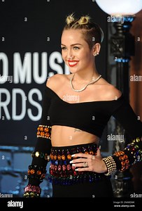 Miley Cyrus arrives at the MTV Video Music Awards on Sunday, Aug. 25, 2013, at the Barclays Center in the Brooklyn borough of New York. (Photo by Evan Agostini/Invision/AP Stock Photo - Alamy