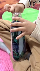 SCRUNCHIE HAND STRECH The container that you store and bring resources is important and can do double duty during OT sessions. I’ve been sharing ideas this week for using hair scrunchies including the bottle that I store them in! This idea is for younger children (for those with DDs) who may be working on bilateral coordination (using both hands together), hand strength, finger isolation, and a pincer grasp. We pinch and poke the scrunchies to get them out of the bottle. We then stretch them to 