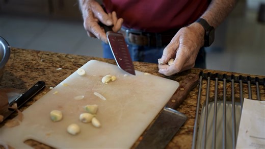 Elderly Man Is Preparing Garlic Mashing Stock Footage SBV-354169157 - Storyblocks