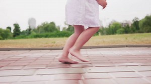 Little girl running in the rain - Free Stock Video