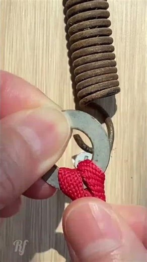 Simple and Effective DIY Hack to Attach a Heavy Spring to a Screw Using a Metal Washer
