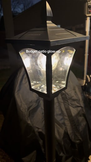 Redoing your patio on a budget starts with lighting. This solar lamp post turns on automatically at night and gives off the perfect warm glow. #patioonabudget #outdoorlighting #patiorefresh #backyardideas #budgethome