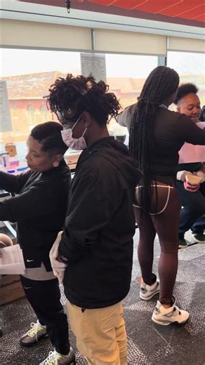 Monet shows an ATC student the first step in taking a dental impression on a patient (student).