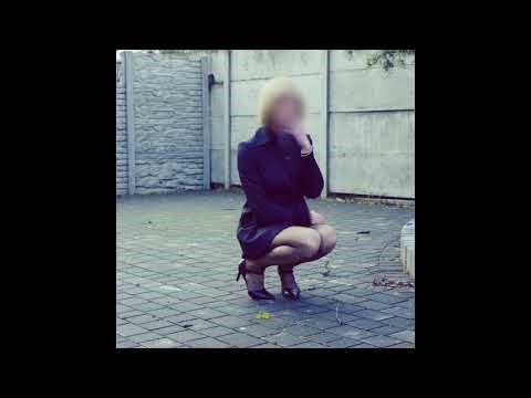 Fishnet tights and high-heeled shoes with a belt