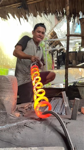 Straightening heated coil spring steel the traditional blacksmith way