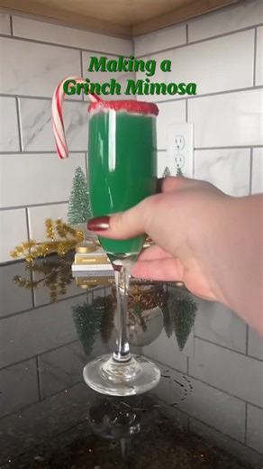 7.5K views · 20 reactions | This Grinch Mimosa will be stealing your heart this Christmas with its three simple ingredients, a glass rimmed with sprinkles, and a whole lot of flavor   With no exact measurements, this recipe calls for equal part blue curacao, orange juice, and champagne. Use vanilla frosting and sprinkle on the rim for that extra sweetness  | Fareway Stores | Facebook