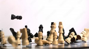 Chess board bouncing and vibrating with pieces falling