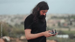 Drone pilot learn to operate a controller, test drive, aero drone control, quadcopter, digital, devices, technology, management and control