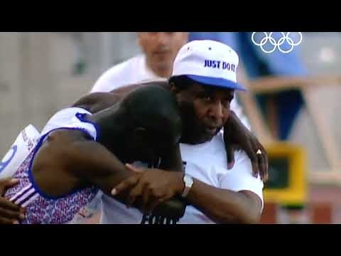Derek Redmond's father helps him across the finish line at the 1992 Olympics