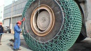 Putting Chains on a Massive Front-End Loader's $60,000 Tires Isn't Easy