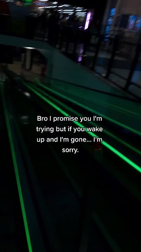 Moving Escalator with Neon Lights in Public Spaces
