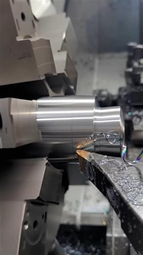 CNC Lathe in Action: Real Machining Process with Metal Chips Flying