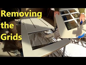 If I break the window, she’ll kill me. Removing the grids from our new entry door. Home build #120