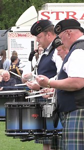A Close up of Ross and Cromarty Pipes and Drums School, as they competed in the Grade 2 bands competition during The North of Scotland Pipe Band Championship - Banchory 2024. This was held at Banchory on Sunday 12th May 2024 and the band, who were led by Pipe Major Niall Matheson and are wearing Ross & Cromarty tartan, were awarded 6th place for this performance. #pipebands #banchory #pipebandchampionship #pipeband #bagpipes | Scotland's Pipe Bands