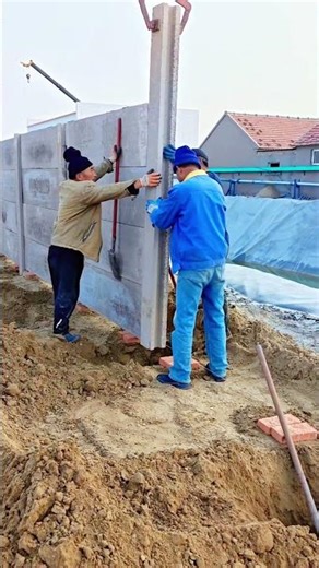 Construction Team Installing Precast Concrete Wall Panels