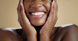 Does smiling really make you more attractive? Experts reveal the psychological impact of smiling