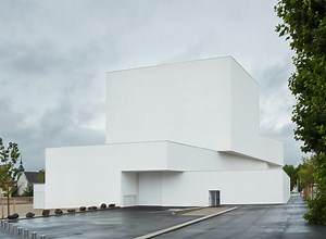 dominique coulon's white volume-stacked theater in france becomes a symbol of the city