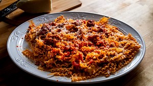 This Spicy Italian sausage ragu needs a heavy pasta to hold up to the sauce. I used mafaldine pasta which is basically narrow lasagna pieces. If you can't find it use a heavy pasta like pappardelle or rigatoni. I hope you enjoy this Spicy Italian sausage ragu recipe! . #mafaldine #sausageragu #italianrecipes | Sip and Feast