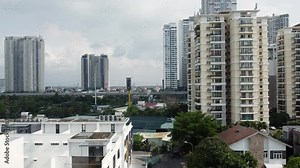Ho Chi Minh Vietnam District 2 skyline and apartment buildings, aerial rising