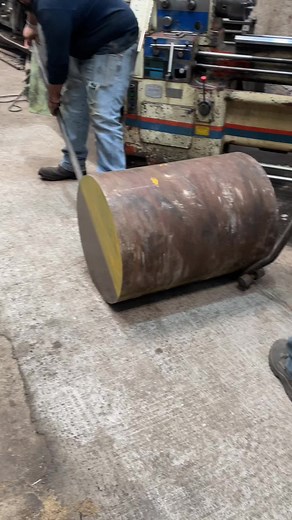 Metalworking Process: Operating a Lathe in Workshop