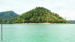 Travelling around an island on the Cheow Lan lake in Thailand