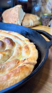 Greek Tiropita, the traditional Epirus way, just like yiayia made! Flaky, homemade phyllo filled with a delicious mix of feta cheese, eggs, and milk. The warm, oven-baked flavor is unforgettable! Follow for more authentic Greek cooking! Recipe below ⬇️ ⚫️ingredients: - 6 cups flour -1,5 cups warm water - 1/2 a cup melted butter - salt - mix melted butter & olive oil in pan to feast the dough * for the filling: - 1 cup feta cheese - 1 cup anthotiro or ricotta (or hloro tiri like my yiayia used to
