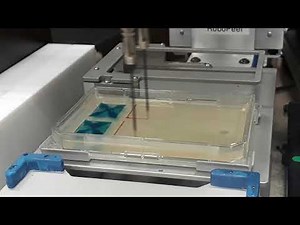Automated spreading of microbial cultures on agar plates using spiral move of Tecan liquid handler.