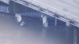 WATCH: Incredible drone video shows aftermath of barge crash into bridge