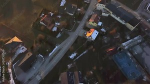Aerial:Flying over beautiful Slovenian countryside on winter sunset. Filming end of winter and autumn slowly waking up.