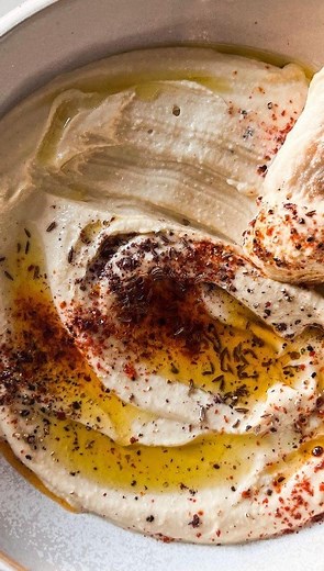 Listen to this incredible story about Rabbi Akiva while learning to make the creamiest hummus. Enjoy this latest edition of Plates and Parables. 🎥 @sinamizrahi Save this recipe🌟 INGREDIENTS 1 can chickpeas drained 2-3 cloves garlic peeled 1 tsp cumin ½ tsp sea salt ⅓ cup tahini paste Juice from half a lemon ⅓ cup water 2 tbsp olive oil PREP Wash chickpeas very well and pick off any loose skin. In the bowl of a food processor, combine chickpeas, garlic, cumin, and salt; blend. Add tahini, lemon