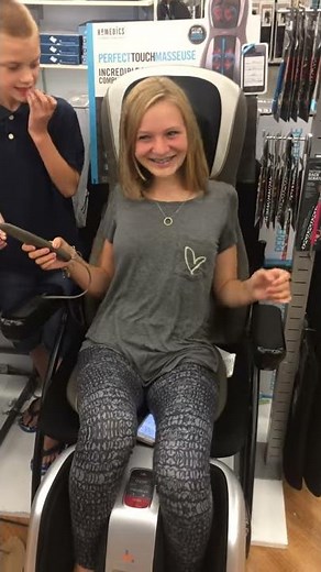 playing with massage chairs