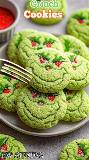 These adorable Grinch Cookies are guaranteed to steal the hearts of all your friends and family this Christmas season ❤️💚❤️ Incredibly festive and fun – just perfect for cookie plates and dessert tables! Ingredients 1 box vanilla cake mix 1/3 cup vegetable oil 2 large eggs 1 tsp vanilla extract 2–3 drops green gel food coloring (Grinch green 💚) 1/2 cup powdered sugar (for rolling) Red candy hearts (or heart sprinkles) Optional: 1 tsp cornstarch for extra soft cookies 👩‍🍳 Instructions 1️⃣ Mix