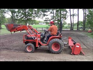 Kubota B7500 HST tilling the garden
