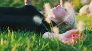 Woman laid in the grass - Free Stock Video