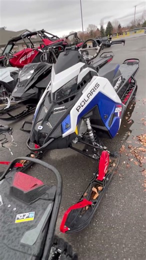 The image features a Polaris 850 PRO RMK snowmobile.