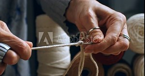 Super slow motion macro of artisan artist creates handmade and handicraft art piece with threads in creative workshop, capturing intricate beauty of craftsmanship and artistic expression at 1000 fps.