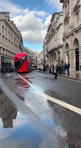 London Businessman Chases Bus, Face-Plants in Puddle, Then Takes a Bow Like a Legend
