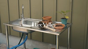 Built to withstand the elements, this wash table lets you keep the mess outside where it belongs. More than just a place to rinse off hands or vegetables before coming in from the garden, it serves a wide range of functions, from barbecue prep area to outdoor wash station at the cottage. Sturdy and rigid, it's made of stainless steel so you can leave it out all season long. Stainless-Steel Outdoor Wash Table: https://bit.ly/4kvq56y | Lee Valley Tools