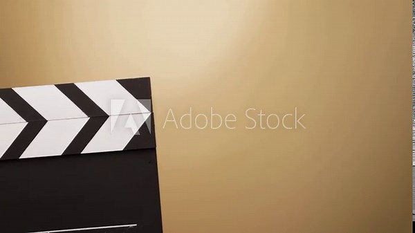 hands with cinema clapper board, behind the scenes of a movie shoot, cinematographer preparing for the next scene, camera rolling