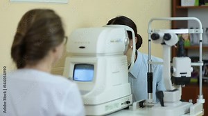 Measuring intraocular pressure of woman in clinic