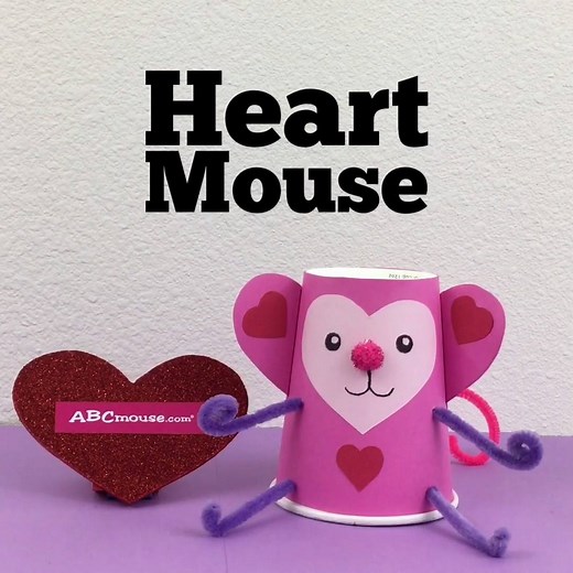 Looking for a fun and easy craft for Valentine's Day? Make this mouse out of paper hearts and other art supplies you have at home. We used a paper cup, pipe cleaners, construction paper, and a pom pom. 💕 🐭 (We're partial to mice, but you can make other animals too. 😉 ) | ABCmouse.com Early Learning Academy