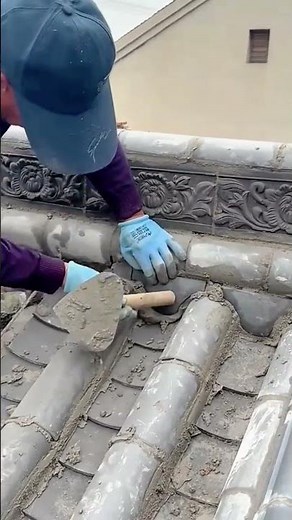 Applying cement mortar on roof tiles for sealing