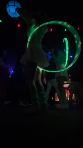 Ash 🦋🪩🦝💜 on Instagram: "3 min video of hula hoop entertainment for Neon Future NYE 2025 💚💫👽"