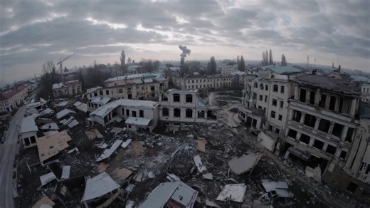 Desolate urban landscape showcasing the aftermath of destruction, with crumbling buildings and debris under a dramatic sky, capturing the haunting beauty of devastation | Premium Stock Video Footage