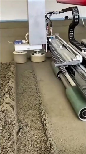 automatic concrete floor leveling machine working on a construction site to create a smooth surface