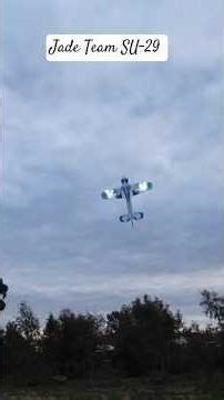 Radio controled aircraft flying with lights on Jade Team RC SU-29 model aircraft