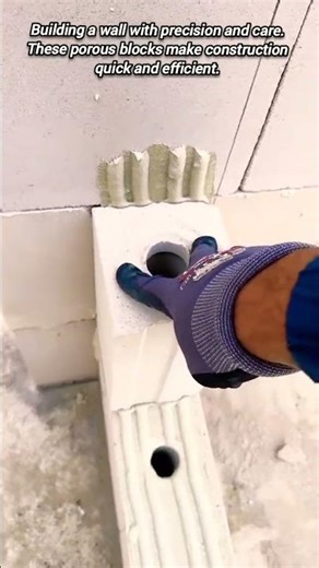 Porous concrete block wall construction process.