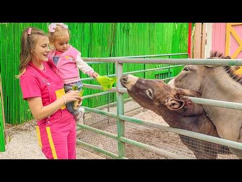 Alice and her aunt feed the animals on the farm
